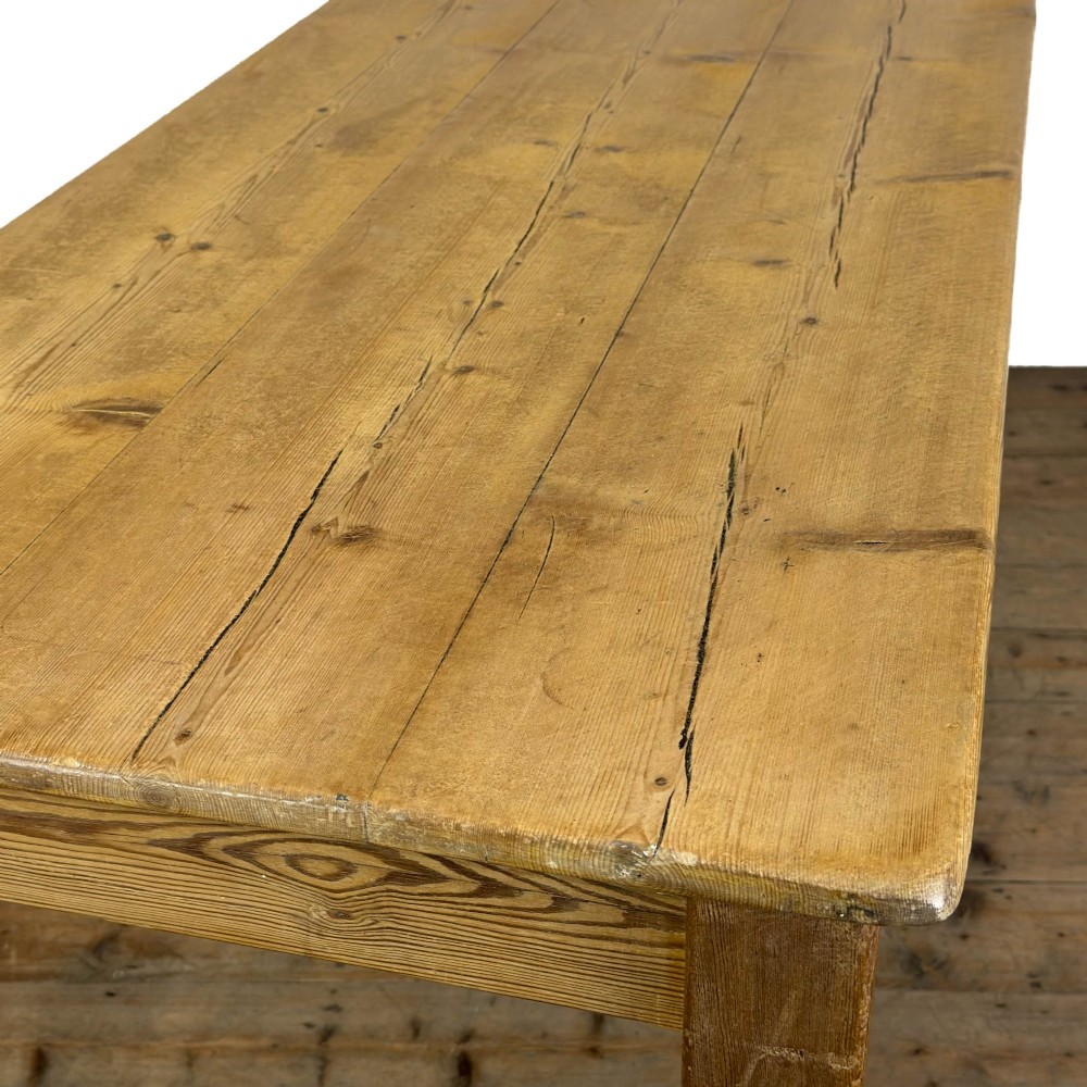 A rustic pine kitchen table featuring a single frieze drawer with a round wooden knob handle and four straight legs. View IX