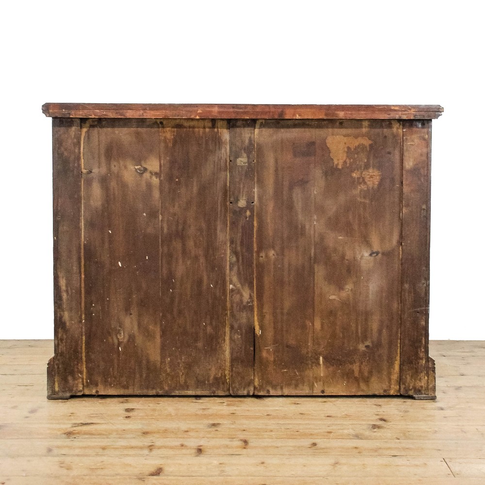 A Victorian satinwood chest of drawers with turned wooden handles, subtle geometric inlaid banding, and a broad plinth base. View III