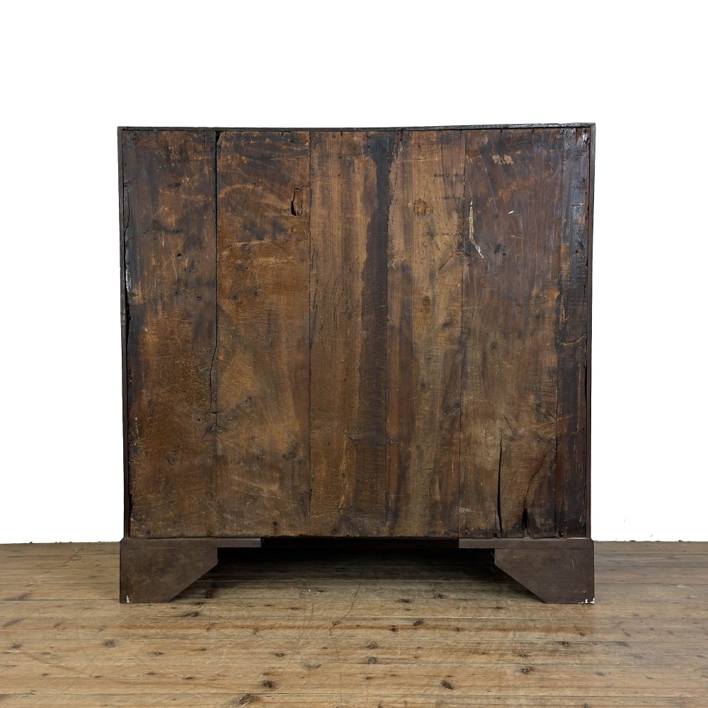 An antique Georgian oak writing bureau featuring a sloping fall-front lid above four drawers with brass swan-neck handles. View IX