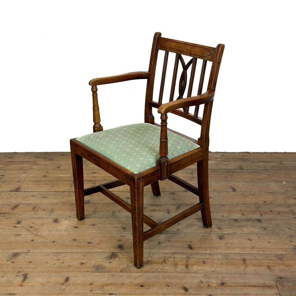 A set of six antique oak dining chairs, including two carvers, featuring geometric inlaid crest rails, decorative back splats, and light green patterned fabric seats. View IV