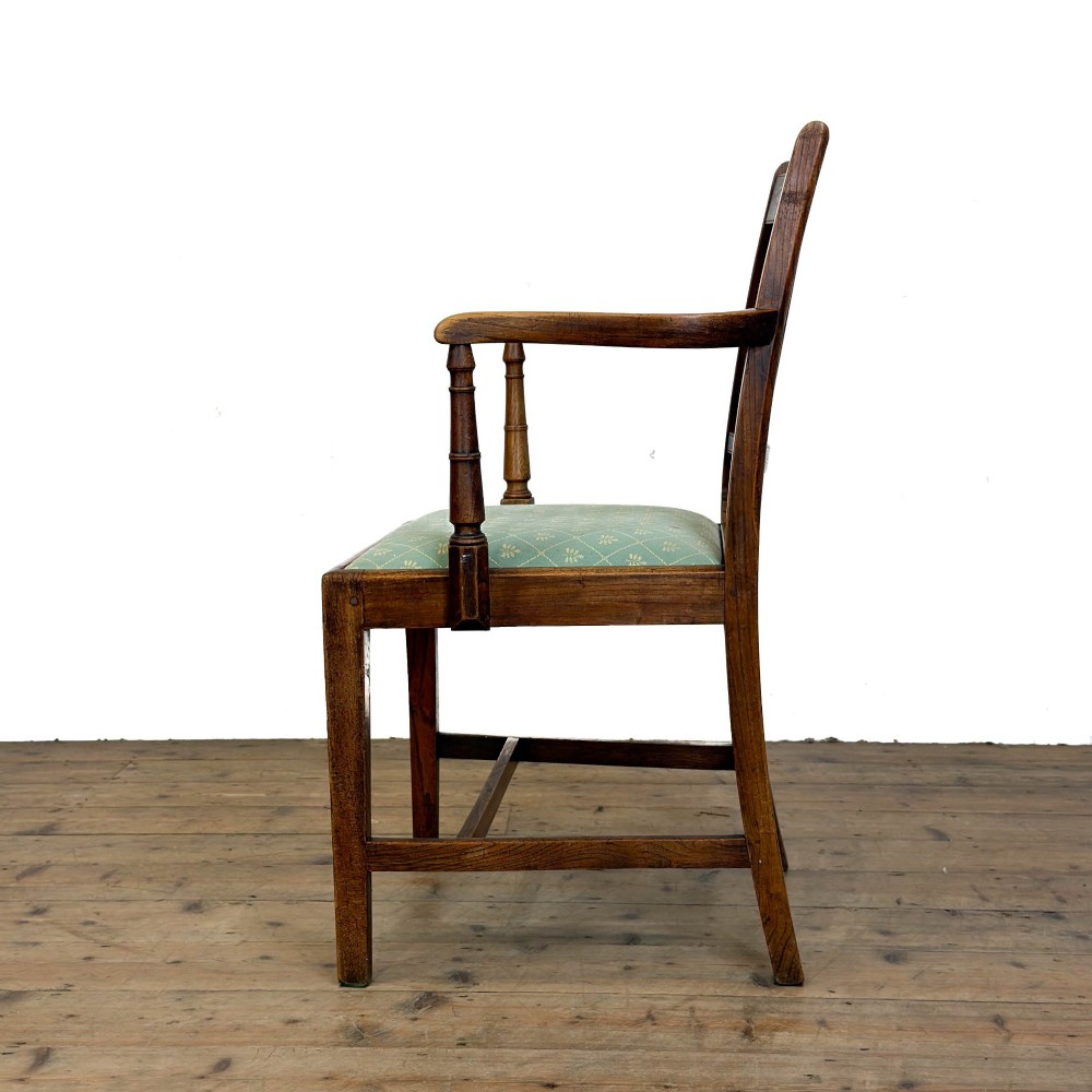 A set of six antique oak dining chairs, including two carvers, featuring geometric inlaid crest rails, decorative back splats, and light green patterned fabric seats. View XI