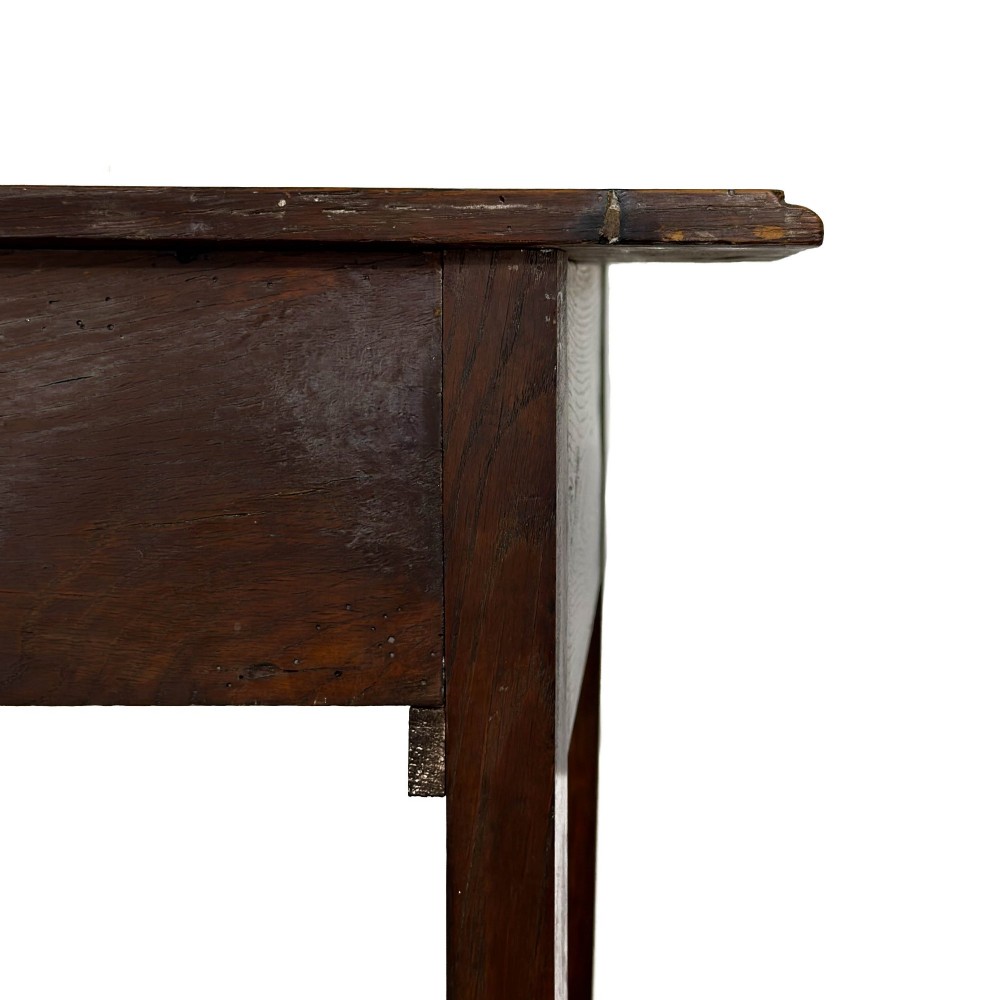 An antique dark oak lowboy side table featuring a single full-width drawer with circular brass handles and straight square legs. View VIII