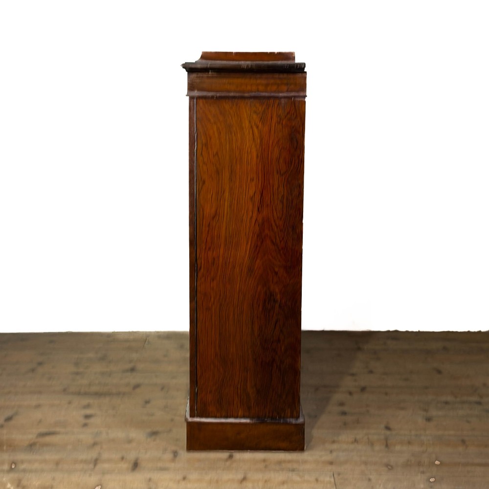 An Edwardian dark mahogany display cabinet featuring two glazed doors, satinwood scroll marquetry along the top frieze, and internal wooden shelves. View II
