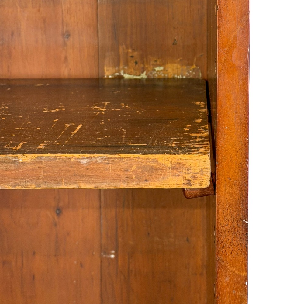 A large antique open mahogany bookcase with a moulded top cornice, multiple storage shelves, and vertical panelled timber backing. View VIII