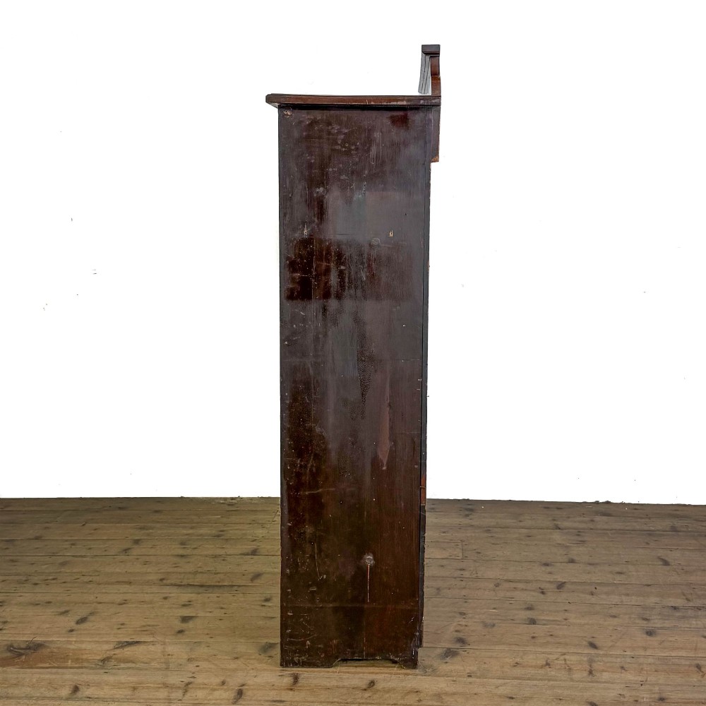 A tall 19th-century open wooden bookcase featuring five fixed shelves, fluted side stiles, a stepped pediment, and a shaped apron base. View IV