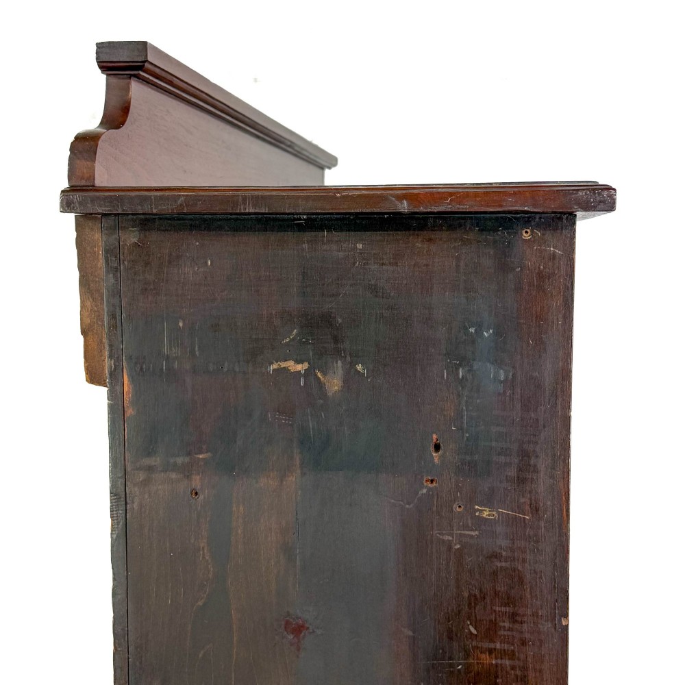 A tall 19th-century open wooden bookcase featuring five fixed shelves, fluted side stiles, a stepped pediment, and a shaped apron base. View VIII