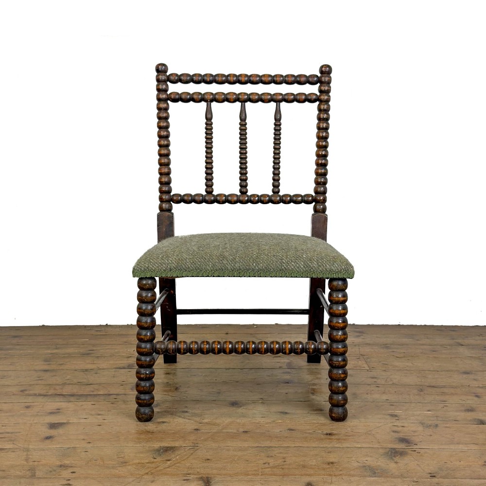 A Victorian bobbin-turned dark timber side chair featuring a textured green wool tweed upholstered seat. View II