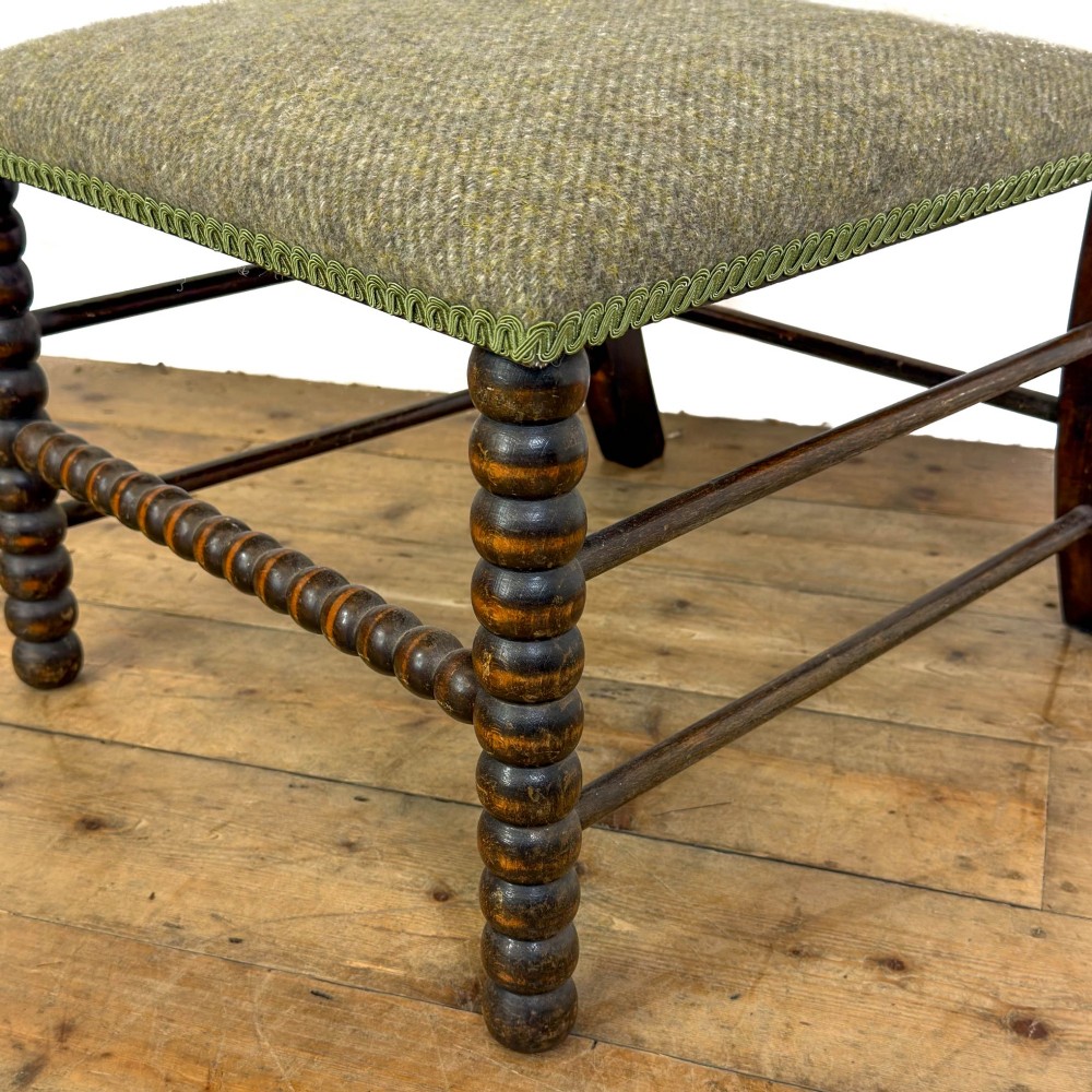 A Victorian bobbin-turned dark timber side chair featuring a textured green wool tweed upholstered seat. View VII