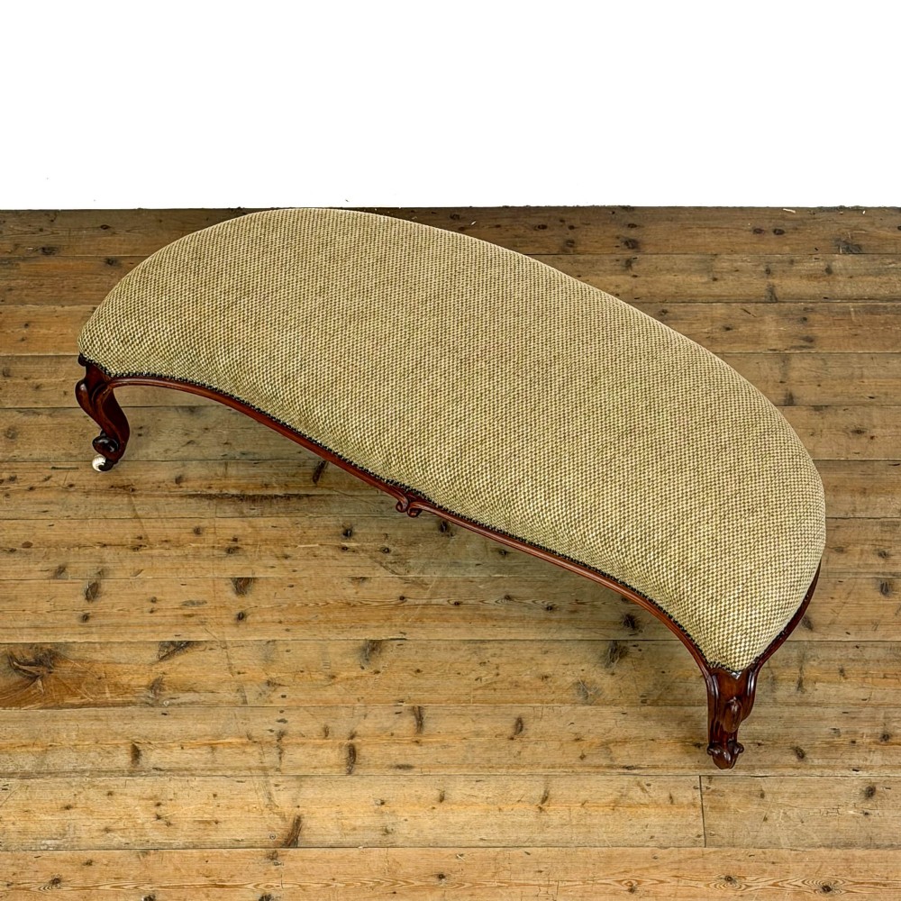 A long curved Victorian upholstered window seat featuring carved mahogany cabriole legs on castors and a patterned textile seat with studding detail. View III