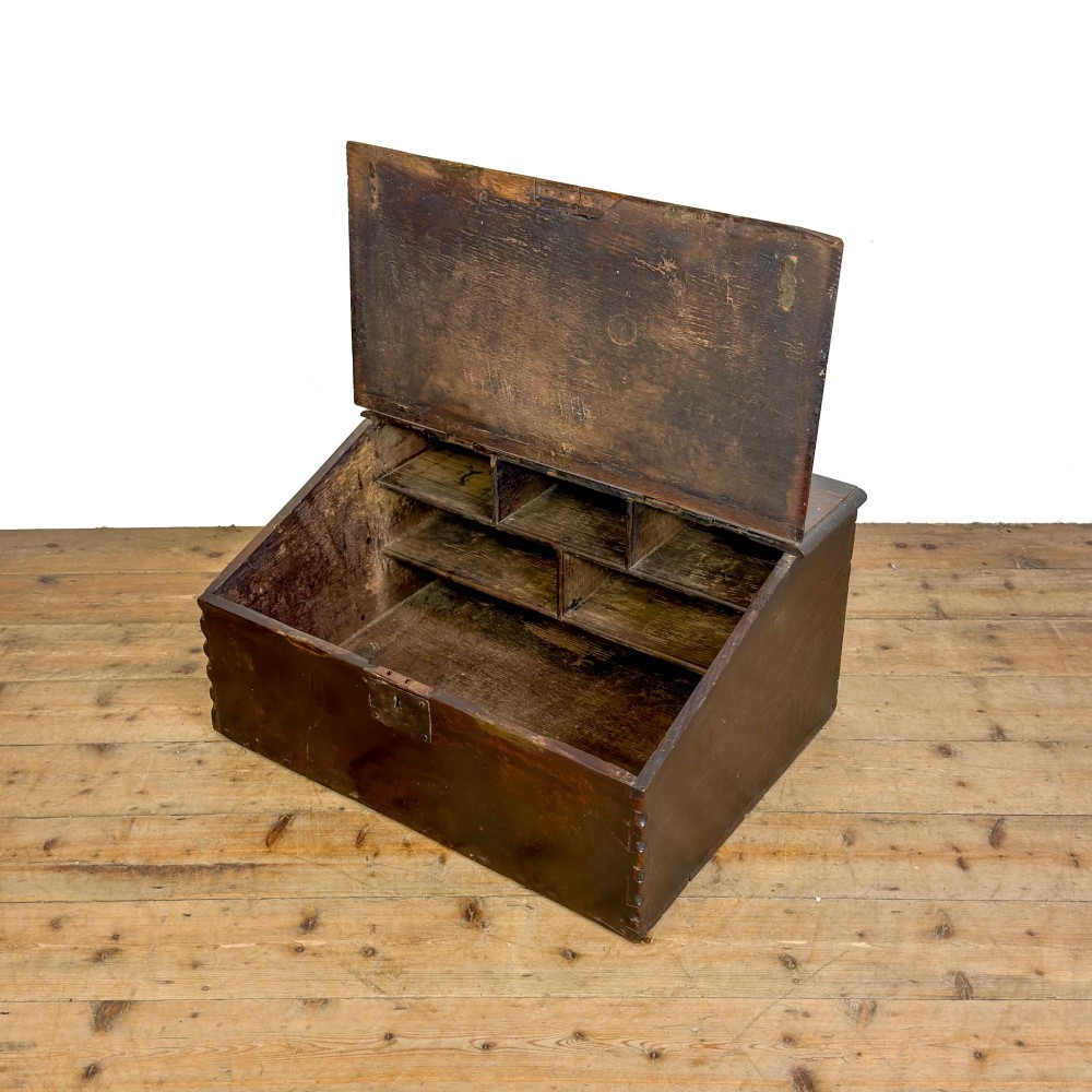A dark brown oak bible box featuring a sloped hinged lid with a wooden rest ledge and an iron lockplate. View IV