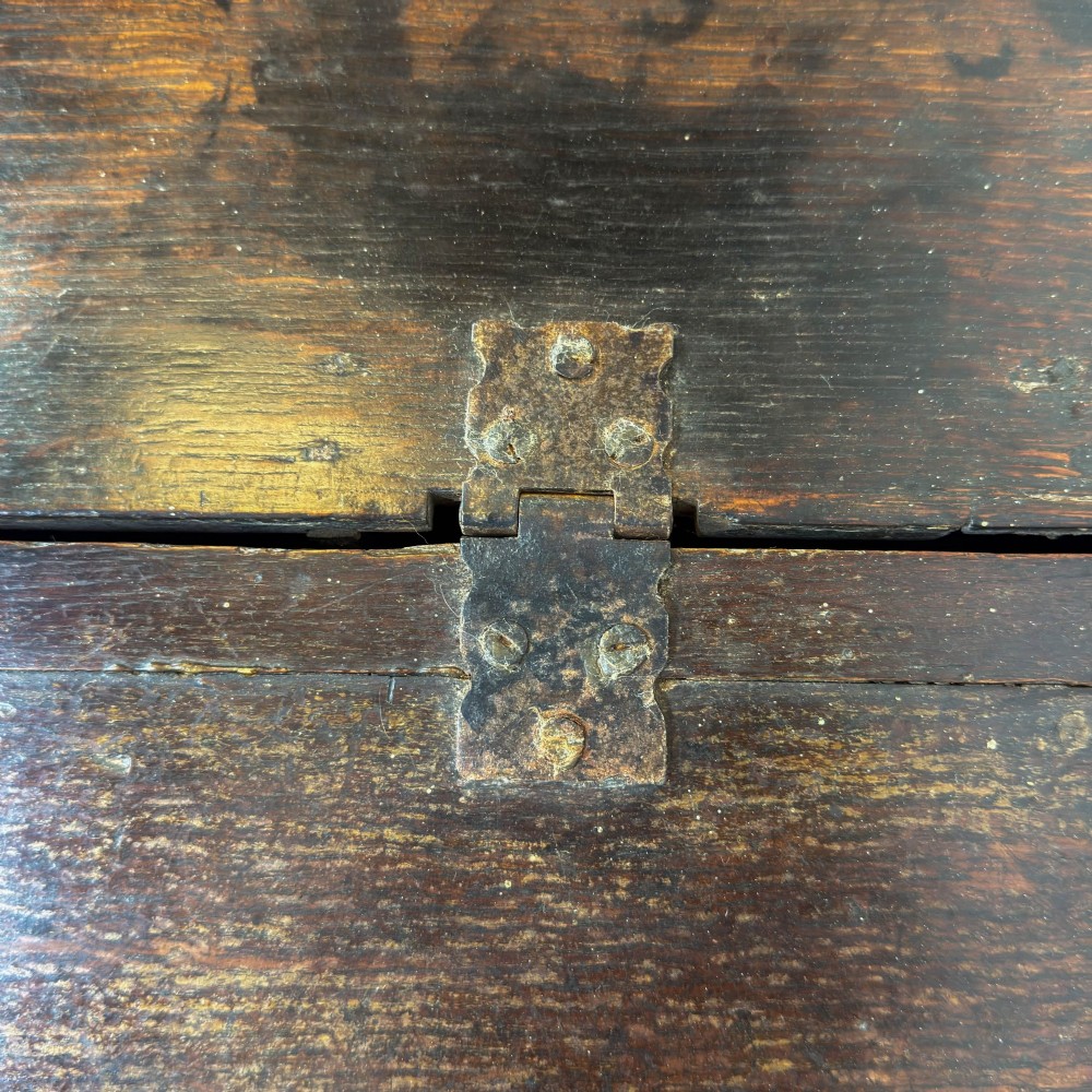 A dark brown oak bible box featuring a sloped hinged lid with a wooden rest ledge and an iron lockplate. View XI