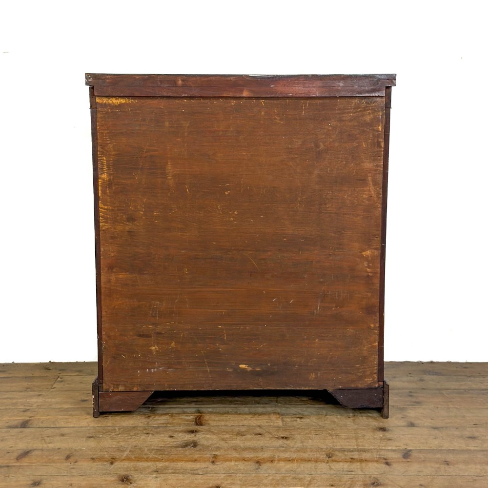 An antique Egyptian Revival mahogany open bookcase featuring fluted pilasters topped with cast brass sphinx heads, adjustable wooden shelves, and a plinth base. View VIII