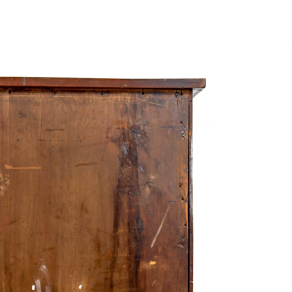 An antique mahogany serpentine chest featuring five graduated drawers with brass swan-neck handles and crossbanded inlay. View IV