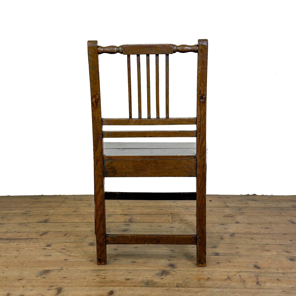 A set of three dark oak farmhouse dining chairs featuring vertical slat backs, solid wooden seats, and sturdy square stretchers. View IX