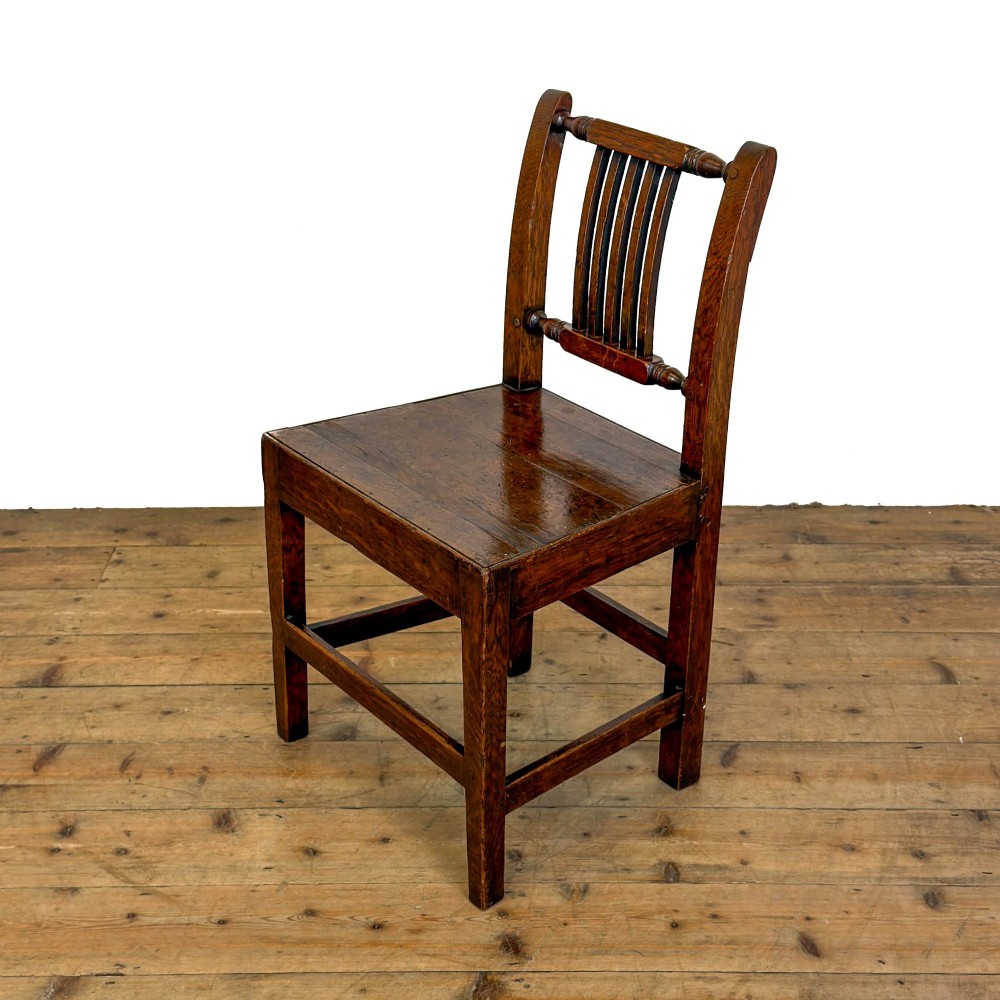 A set of three dark oak farmhouse dining chairs featuring vertical slat backs, solid wooden seats, and sturdy square stretchers. View XI