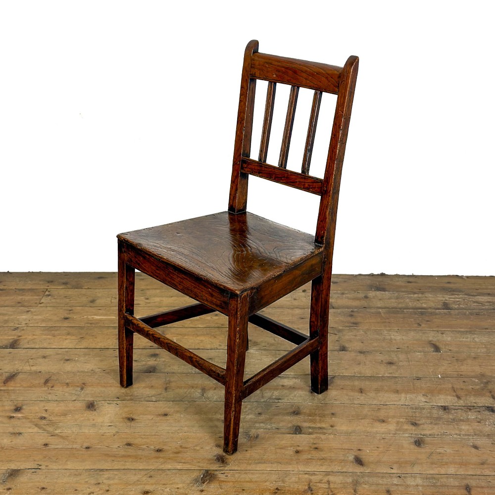 A set of three dark oak farmhouse dining chairs featuring vertical slat backs, solid wooden seats, and sturdy square stretchers. View XIII