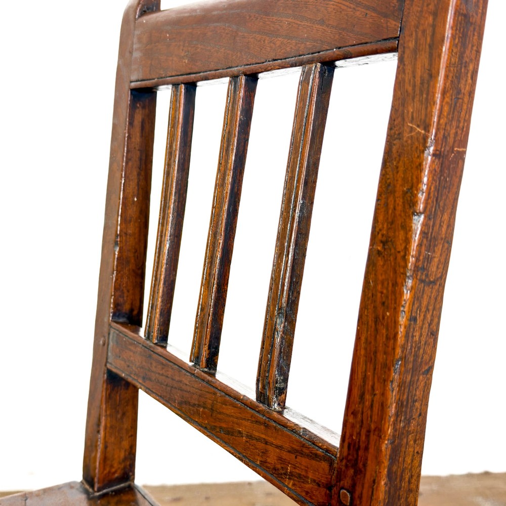 A set of three dark oak farmhouse dining chairs featuring vertical slat backs, solid wooden seats, and sturdy square stretchers. View XIV
