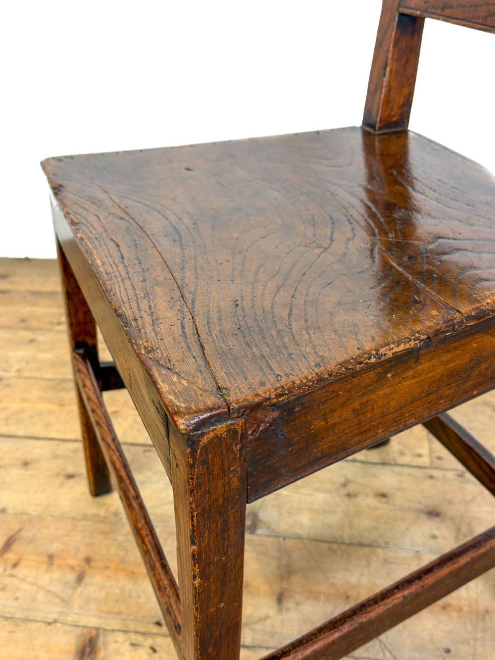 A set of three dark oak farmhouse dining chairs featuring vertical slat backs, solid wooden seats, and sturdy square stretchers. View XV
