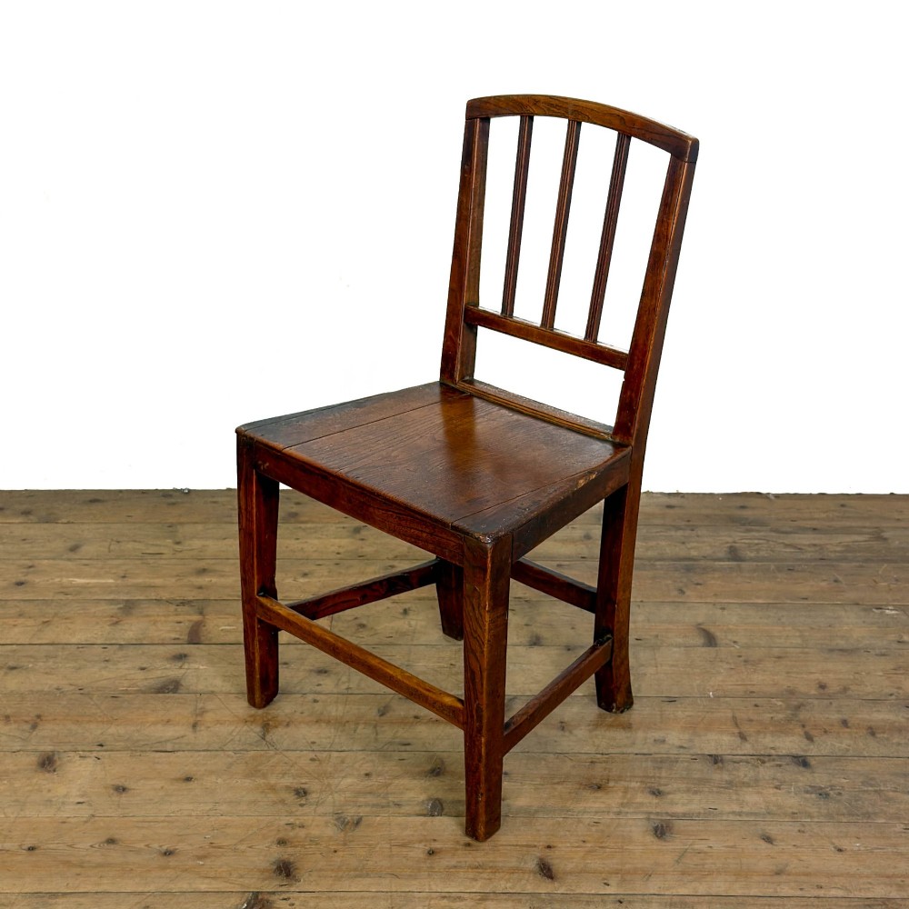 A set of four dark oak dining chairs with vertical slat backrests, solid timber seats, and straight square legs joined by stretchers. View II