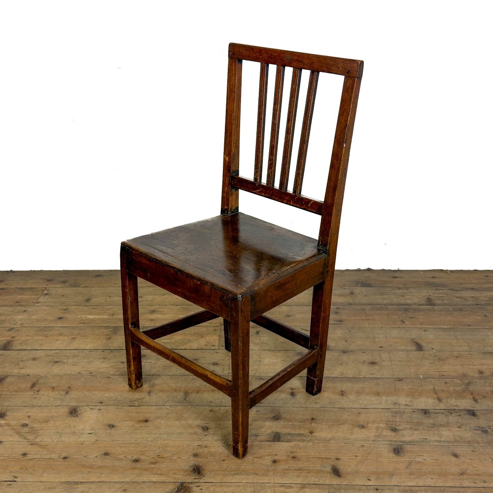 A set of four dark oak dining chairs with vertical slat backrests, solid timber seats, and straight square legs joined by stretchers. View XIII
