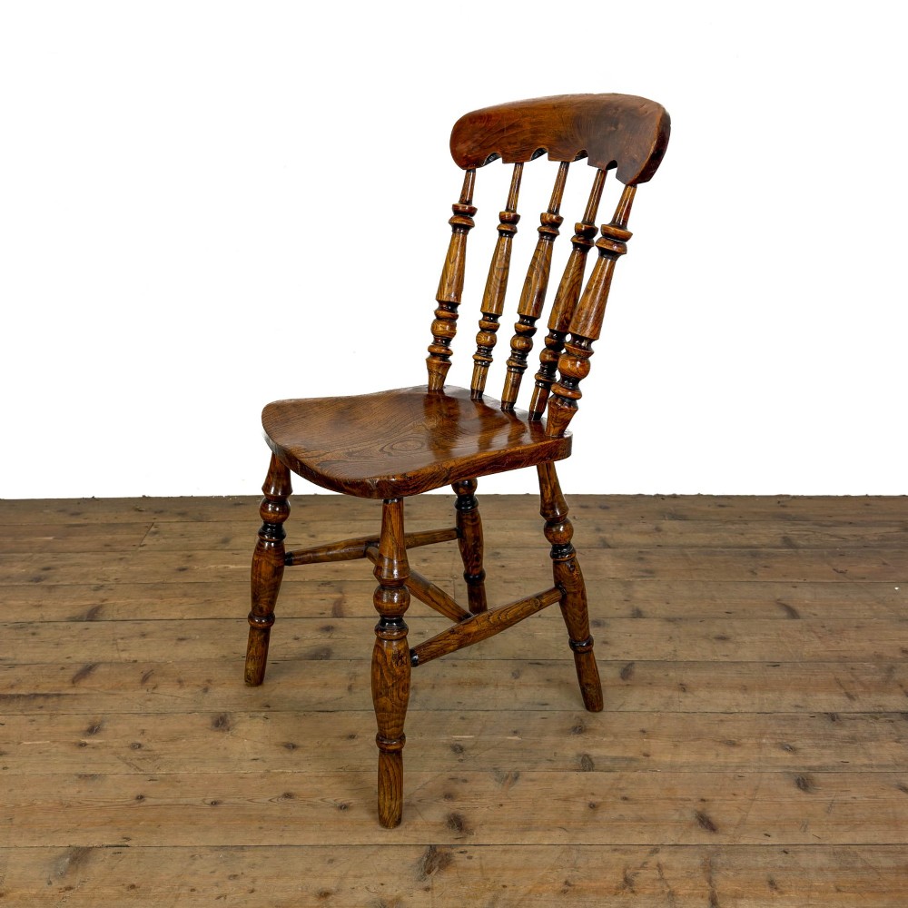 A matching set of four wooden farmhouse kitchen chairs featuring turned spindle backs, contoured seats, and turned legs connected by H-stretchers. View VIII