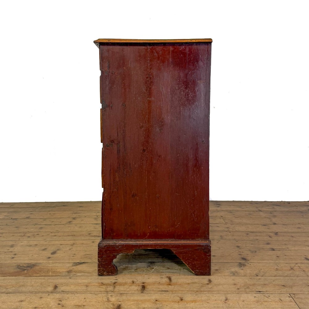 A Georgian mahogany chest of drawers featuring two short over four long graduated drawers with brass swan-neck handles and bracket feet. View VIII