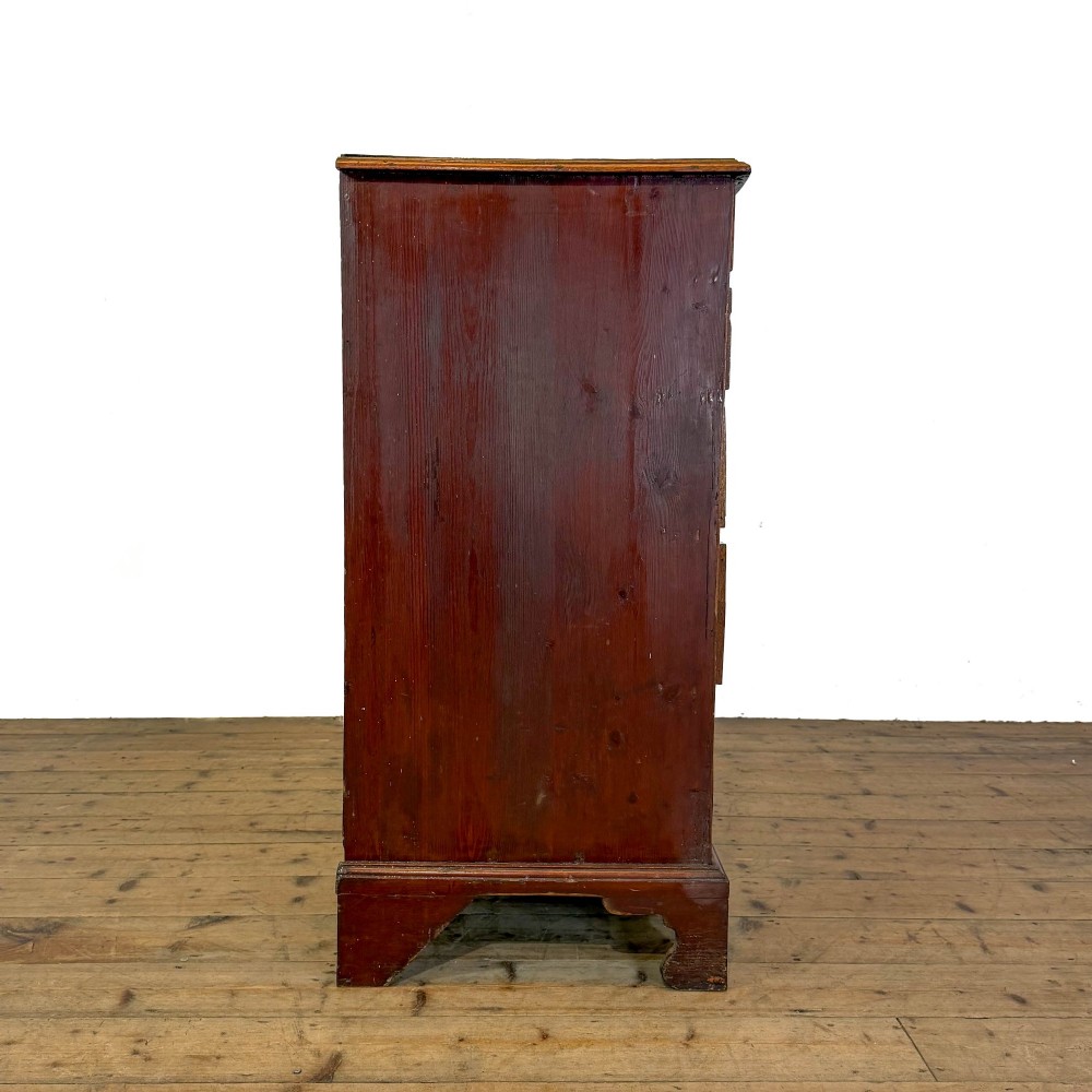 A Georgian mahogany chest of drawers featuring two short over four long graduated drawers with brass swan-neck handles and bracket feet. View X