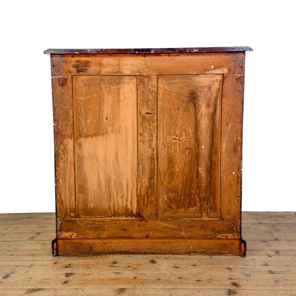 A 19th-century mahogany chest of drawers featuring two short drawers over three long drawers with turned wooden knobs and a solid plinth base. View VI
