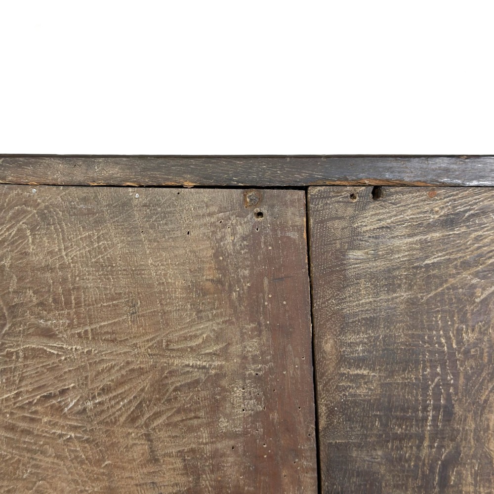 An 18th-century Welsh dark oak Carmarthenshire coffer featuring upper cupboard doors with pointed arch fielded panels above multiple drawers fitted with brass knobs. View IX
