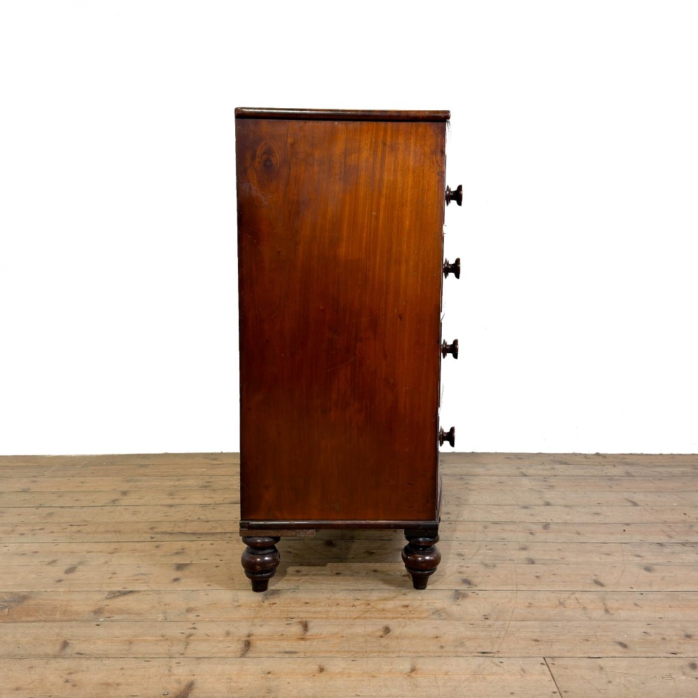 A Victorian mahogany bow front chest of drawers with two short over three long drawers, turned wooden knobs, and turned feet. View VII