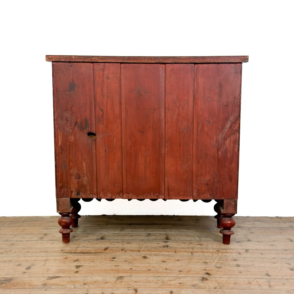 A Victorian mahogany chest of drawers featuring two short drawers over three long drawers with turned wooden knobs and a scalloped lower apron. View X