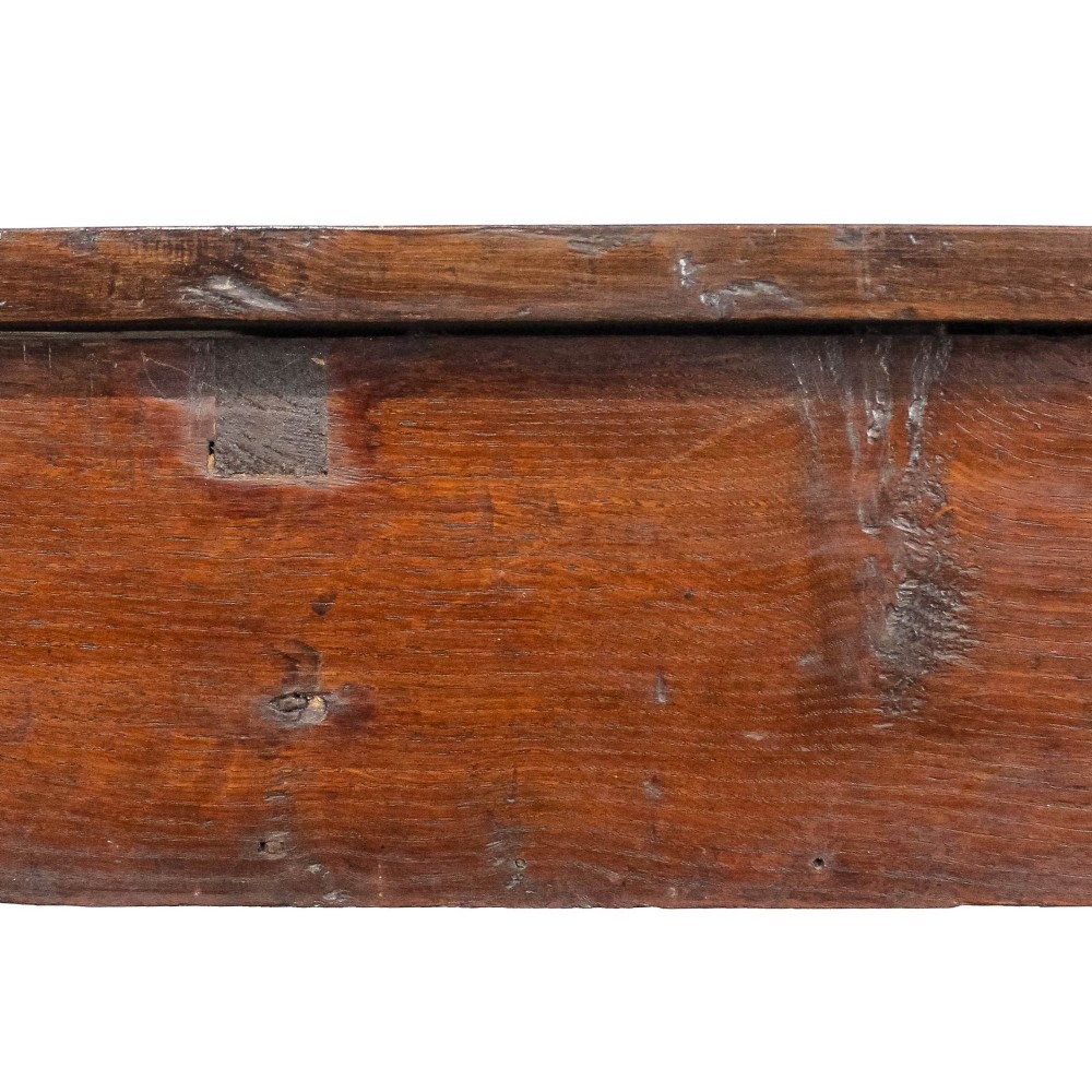 An antique dark oak kitchen table featuring a rectangular top, an end drawer with a brass knob, straight legs, and a low H-stretcher base. View V