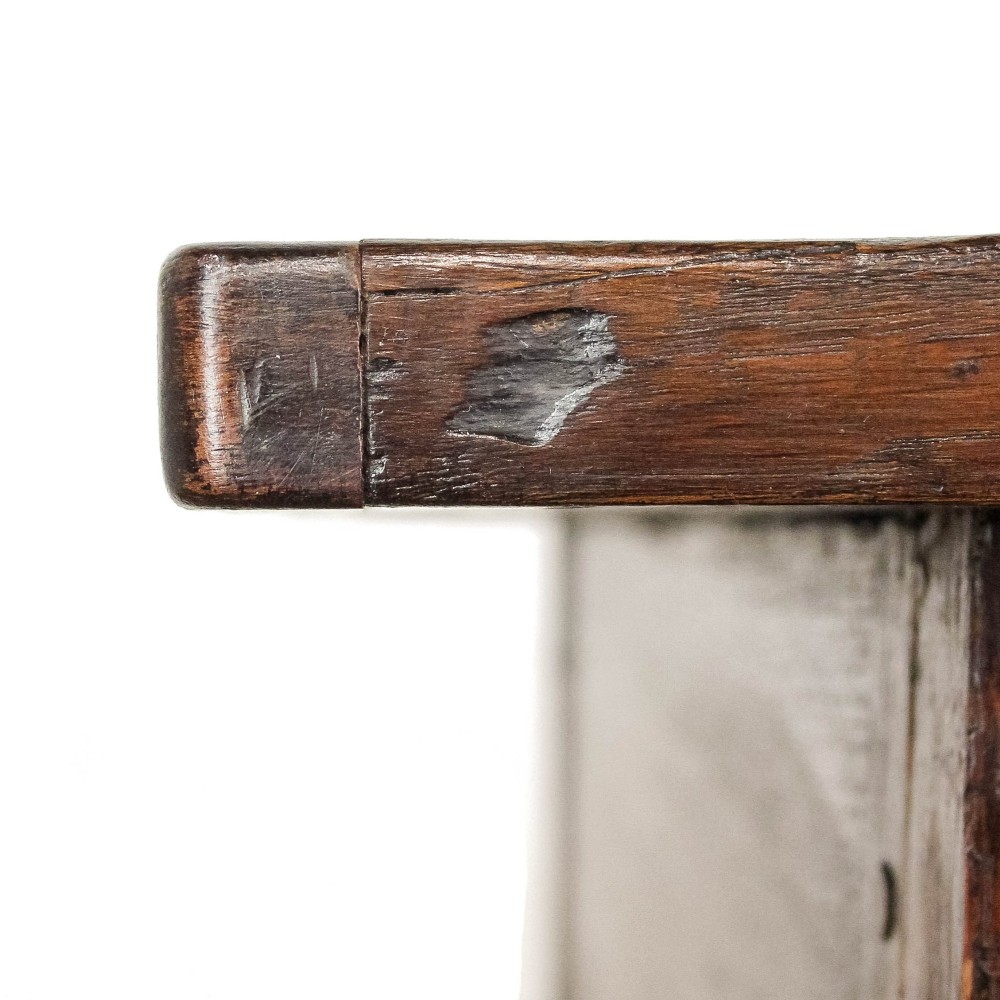 An antique dark oak kitchen table featuring a rectangular top, an end drawer with a brass knob, straight legs, and a low H-stretcher base. View VI