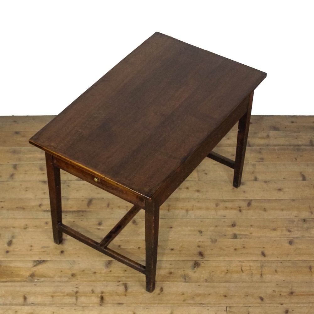An antique dark oak kitchen table featuring a rectangular top, an end drawer with a brass knob, straight legs, and a low H-stretcher base. View XIII