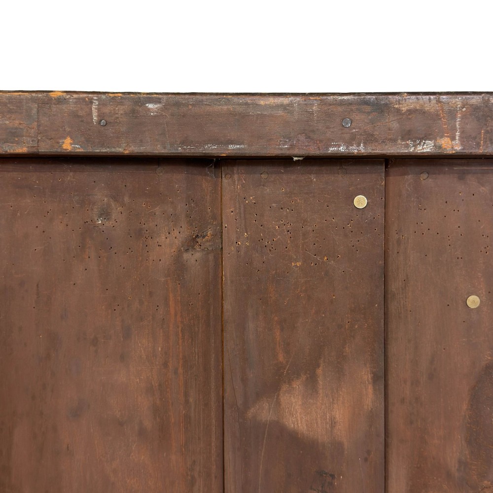 A Victorian mahogany chest of drawers featuring a bowfront profile, two short over three long graduating drawers, turned wooden knobs, and turned feet. View XI
