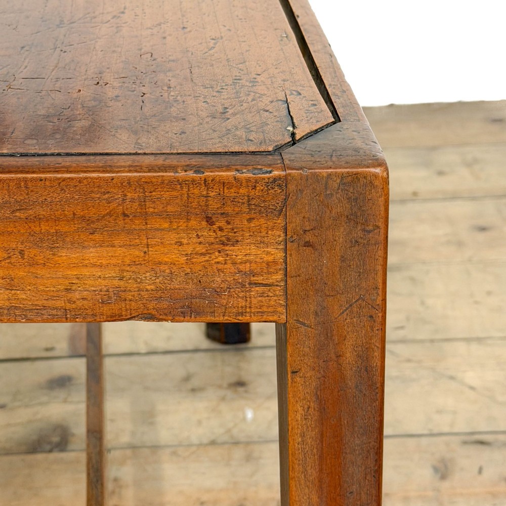 An antique fruitwood armchair in the Chippendale style featuring a pierced back splat, shaped armrests, a solid wood seat, and square legs with stretchers. View IX