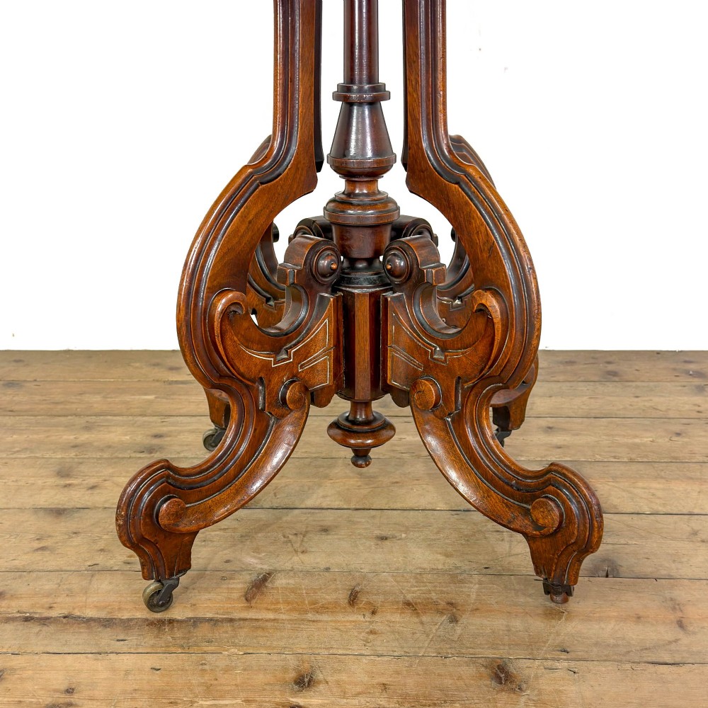A circular Victorian side table featuring a white marble top supported by a carved mahogany pedestal base with scrolled legs. View III