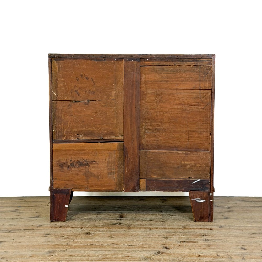 An antique Georgian mahogany bow-front chest of drawers with four graduated drawers and brass oval drop handles. View V