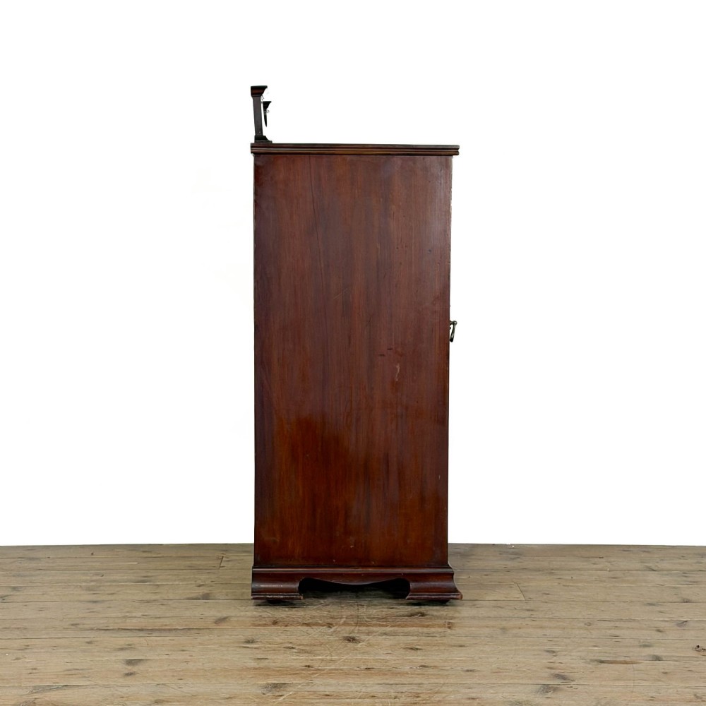 An antique dark wood Art Nouveau display cabinet featuring floral marquetry inlays, a single glazed glass door, and a shaped cresting gallery. View III