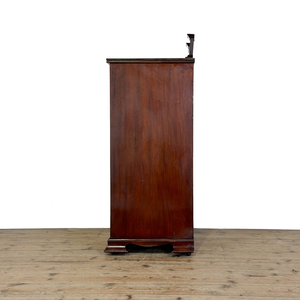 An antique dark wood Art Nouveau display cabinet featuring floral marquetry inlays, a single glazed glass door, and a shaped cresting gallery. View VIII