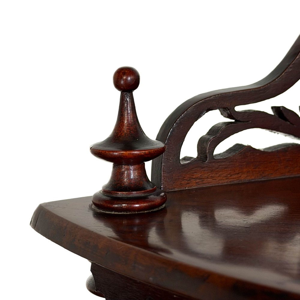 A four-tier Victorian mahogany corner whatnot featuring open shelving supported by barley twist columns and topped with a pierced fretwork pediment. View VIII