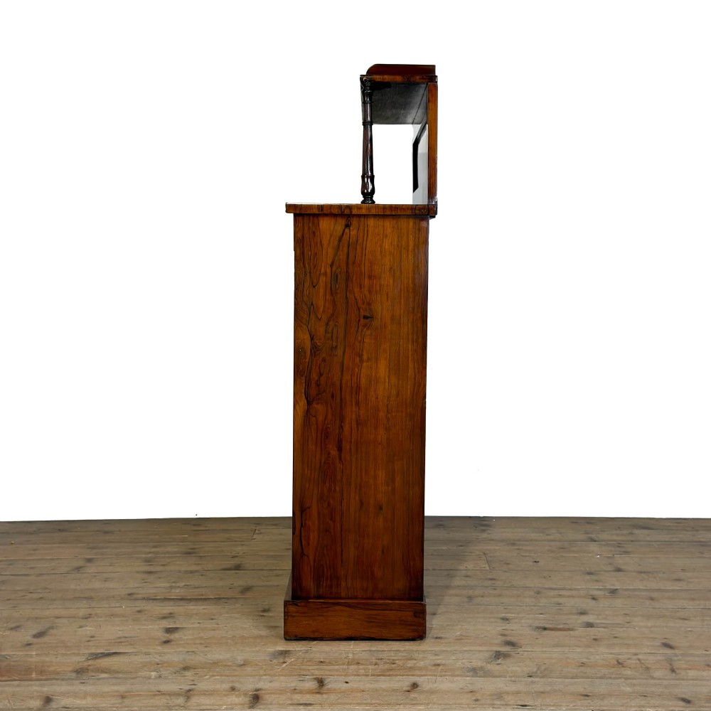 An antique rosewood open bookcase featuring a raised back gallery flanked by turned columns, with three open shelves and a beaded trim. View VI