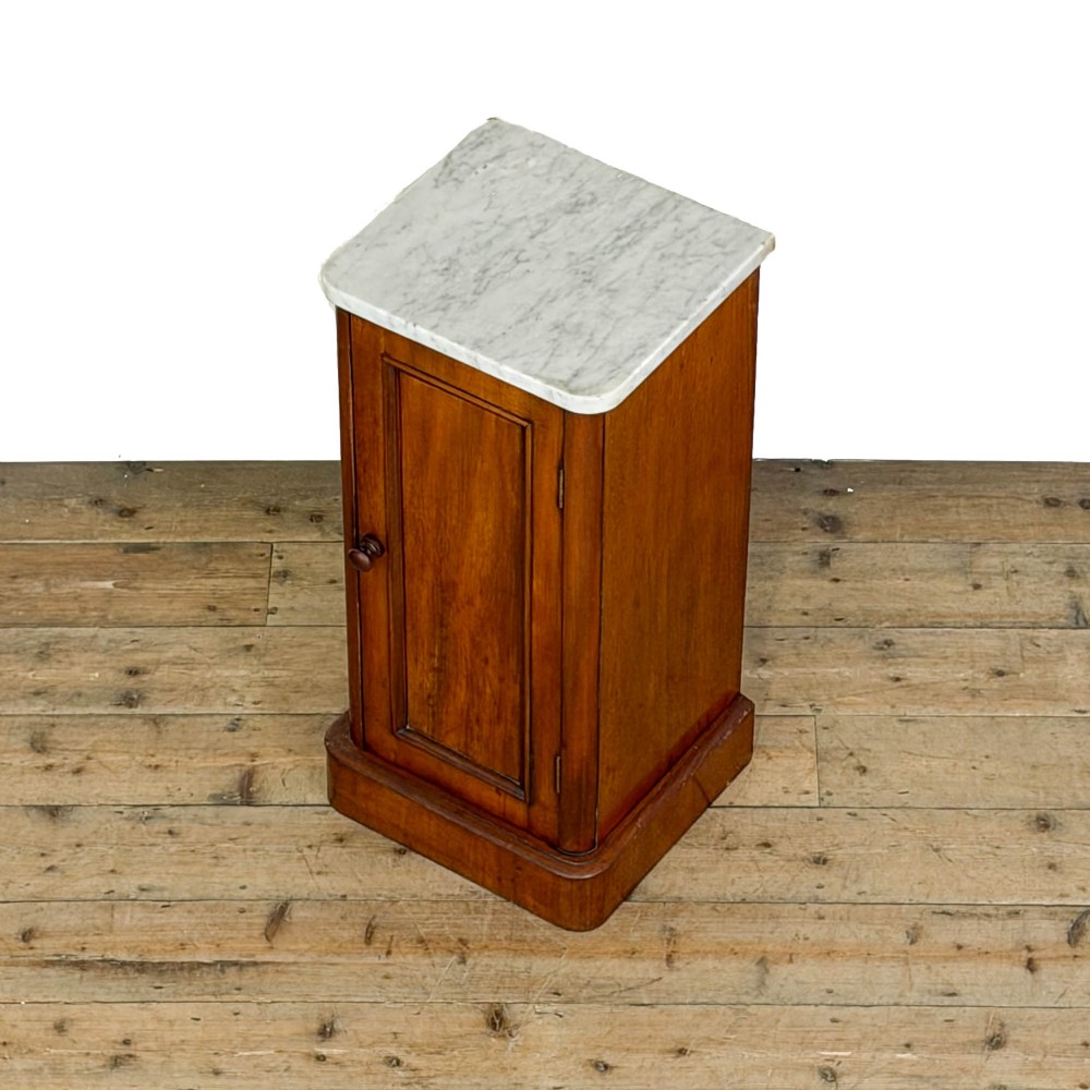 A Victorian mahogany pot cupboard featuring a single panelled door with a turned handle and a white marble top. View III