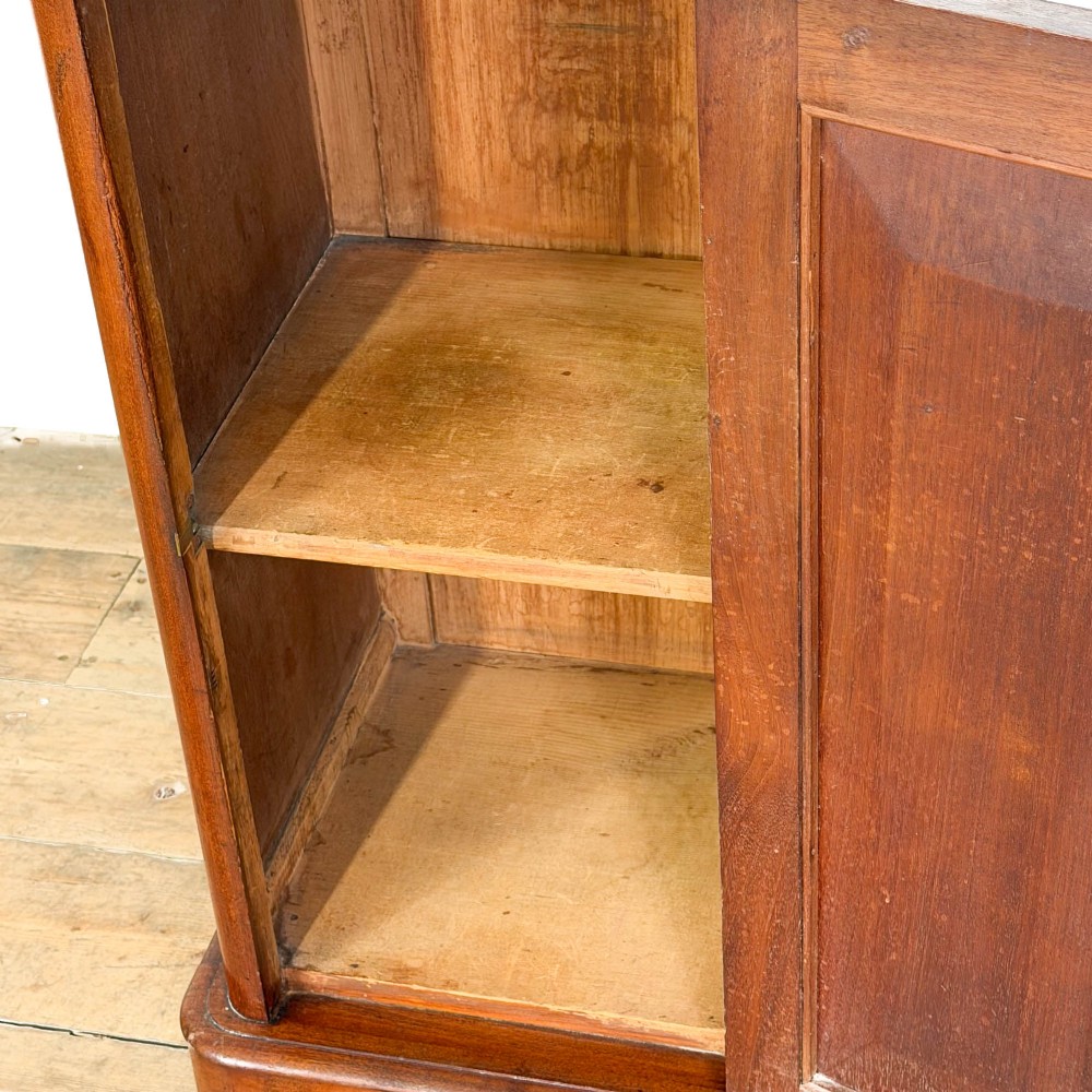 A Victorian mahogany pot cupboard featuring a single panelled door with a turned handle and a white marble top. View V