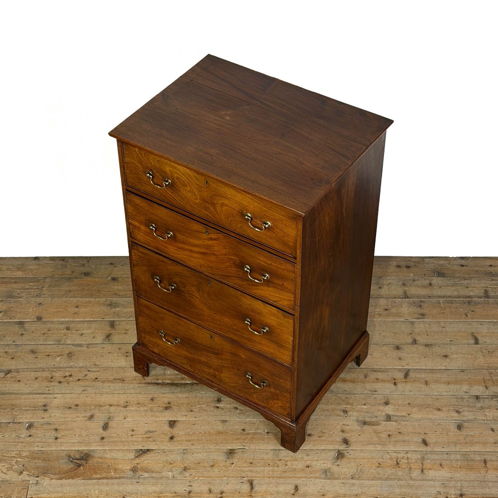 A four-drawer Georgian chest of drawers crafted from dark mahogany wood featuring brass swan-neck handles and bracket feet. View II