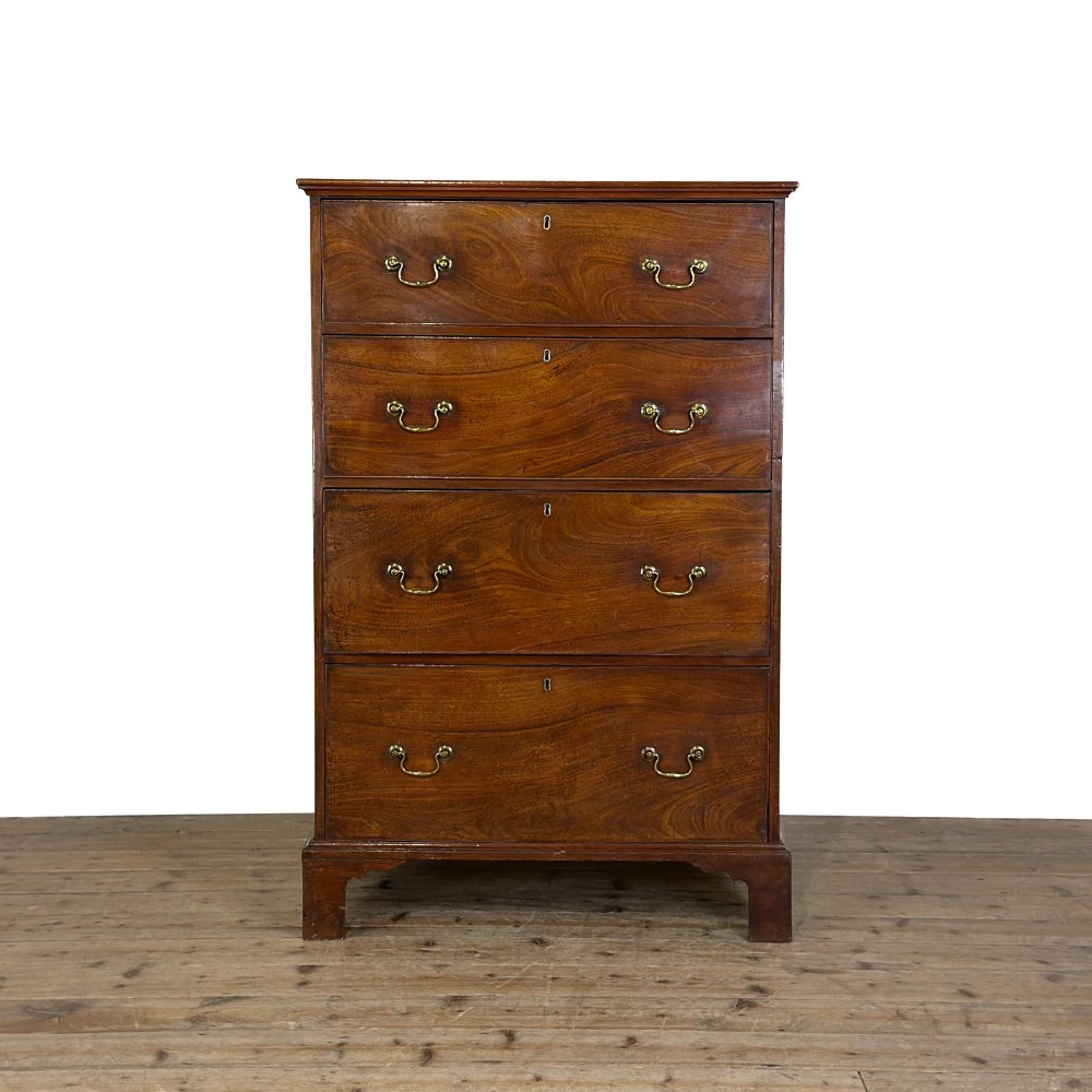 A four-drawer Georgian chest of drawers crafted from dark mahogany wood featuring brass swan-neck handles and bracket feet. View IX