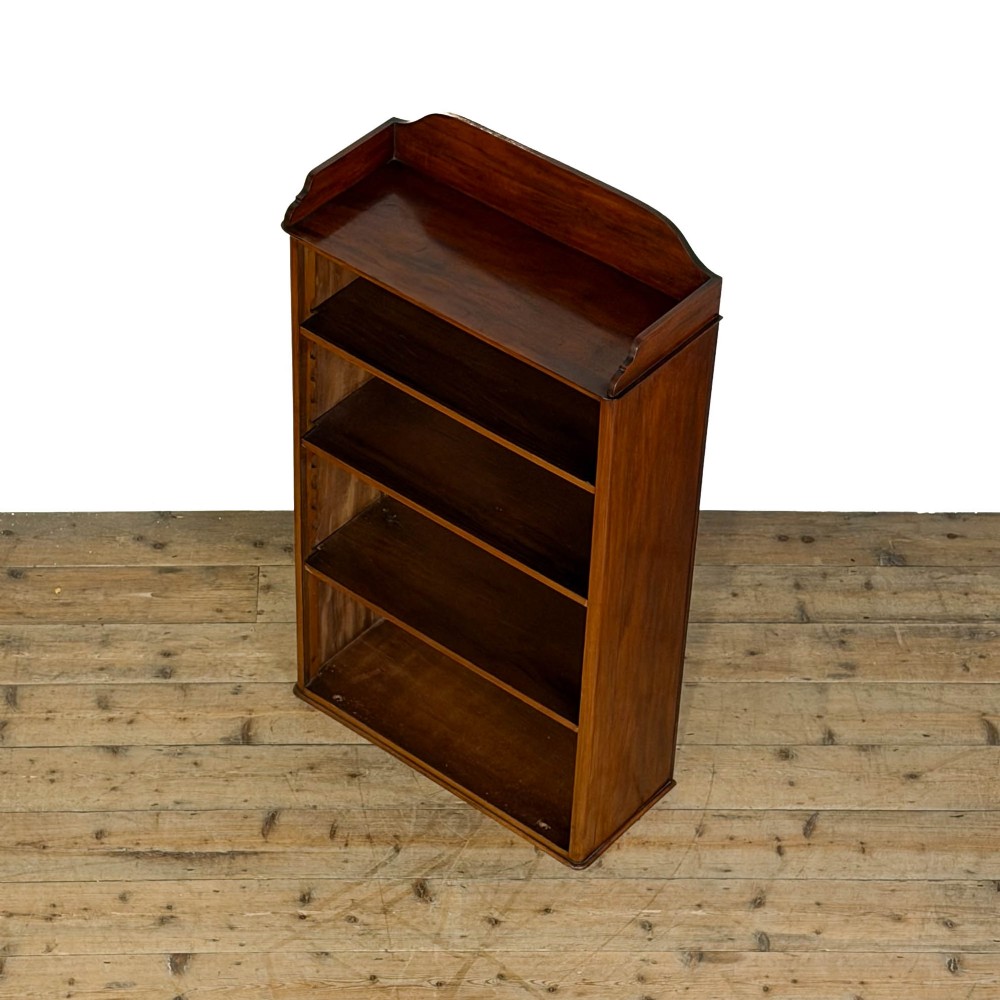A small antique open mahogany bookcase featuring four tiers of shelving and a galleried top upstand. View II