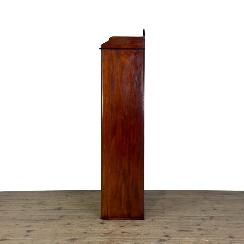 A small antique open mahogany bookcase featuring four tiers of shelving and a galleried top upstand. View IV