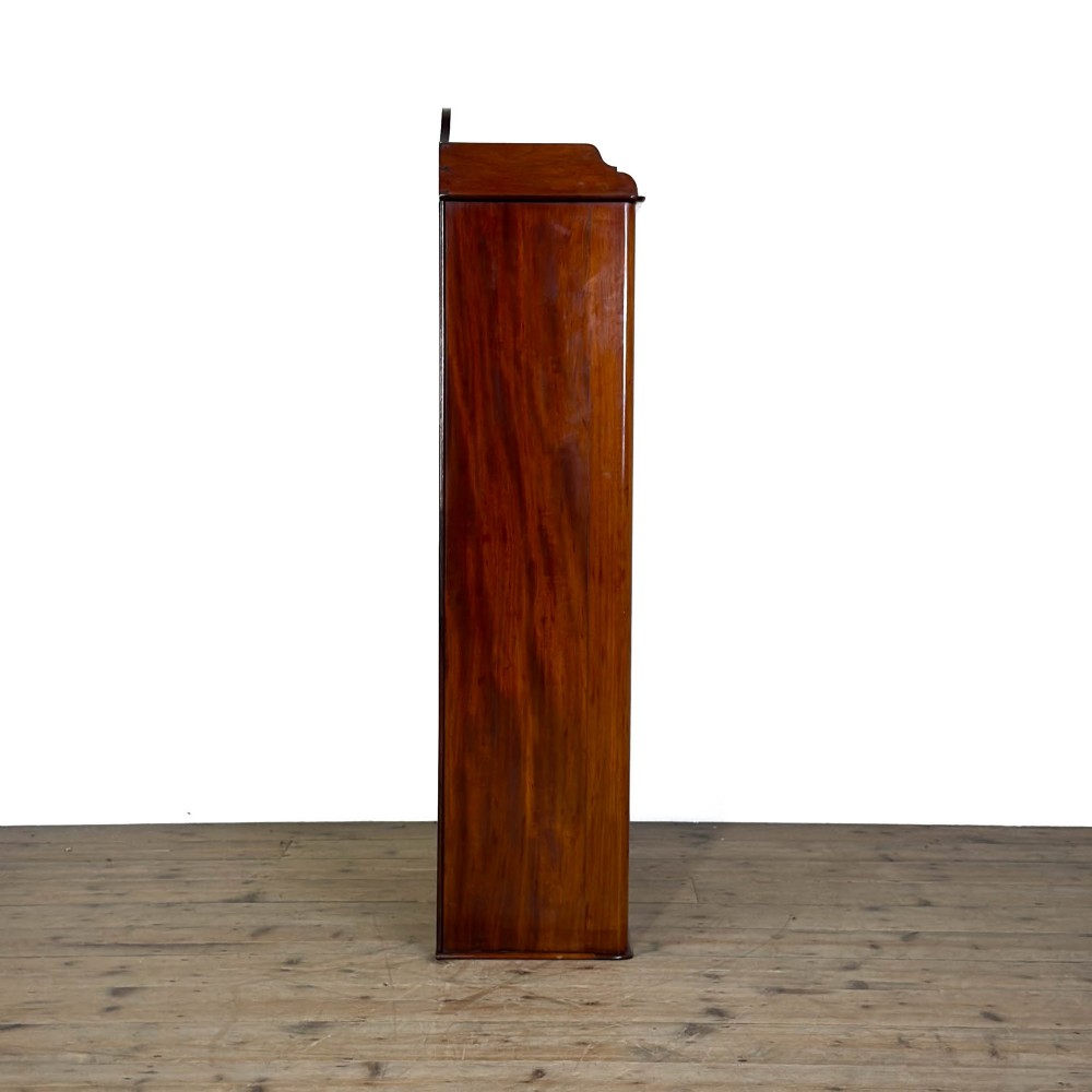 A small antique open mahogany bookcase featuring four tiers of shelving and a galleried top upstand. View VIII