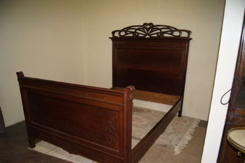 A Marjorelle Style Art Nouveau Walnut Double Bed